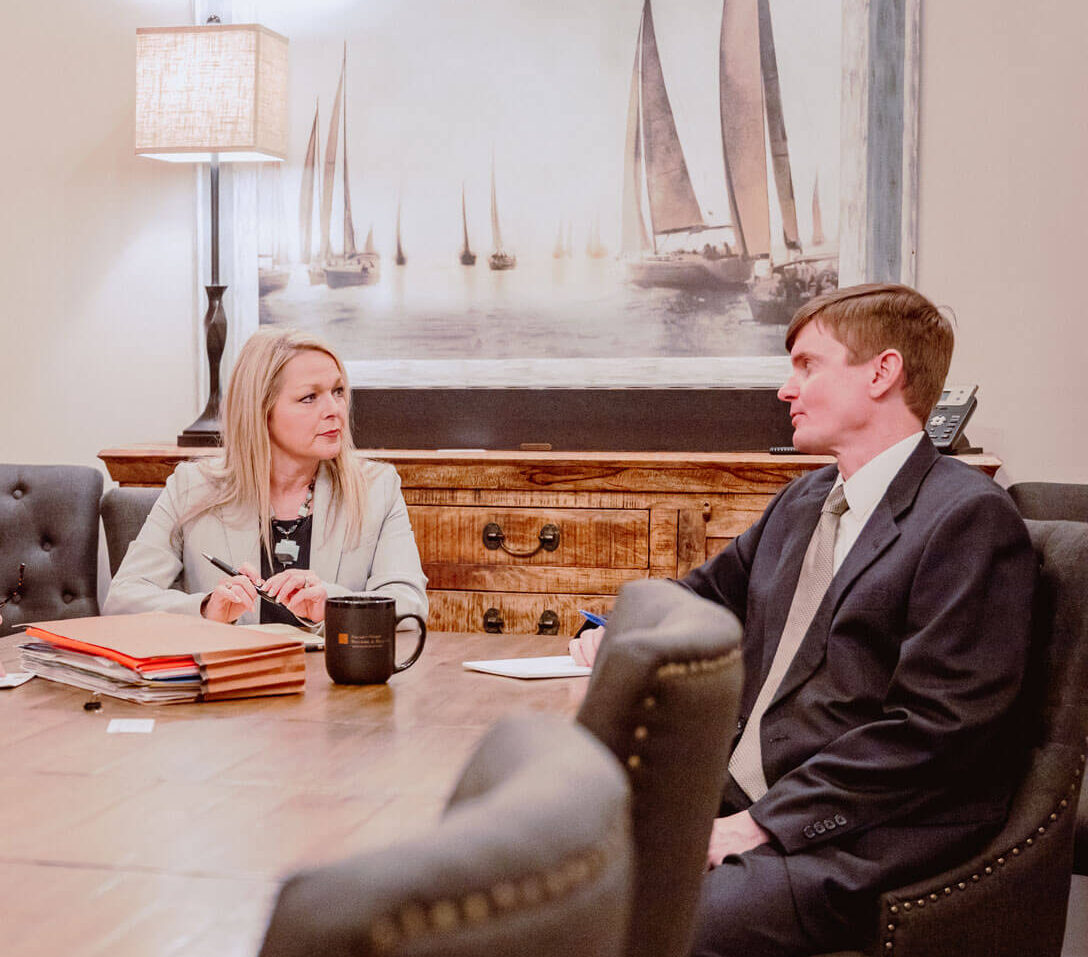 attorneys talking at a table